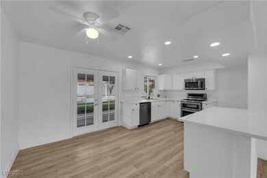 Kitchen featuring visible vents, light wood-style