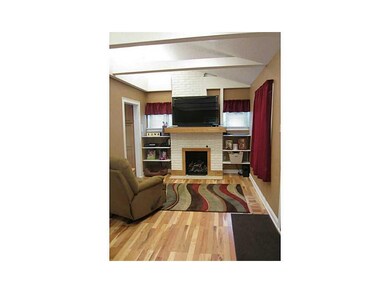 Fireplace. The brick fireplace makes this room coz