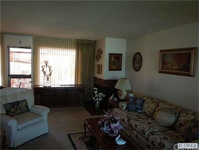 Living room with corner fireplace.