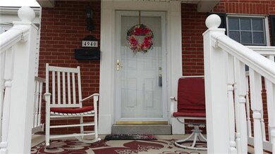 The covered entry features a new front door, and r