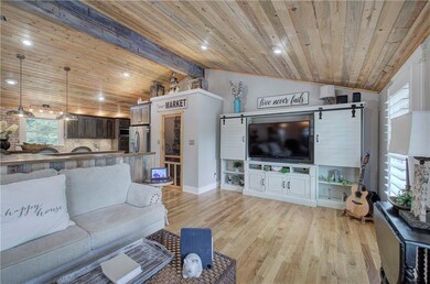 Living area featuring wood ceiling, light wood-style floors, and recessed lighting