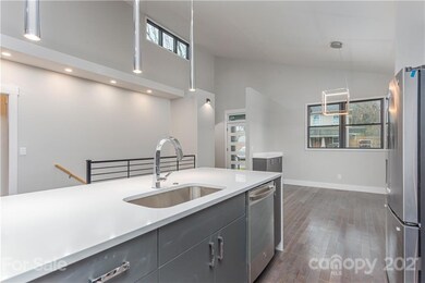 Tall ceilings, open concept, dining room, living room with balcony behind