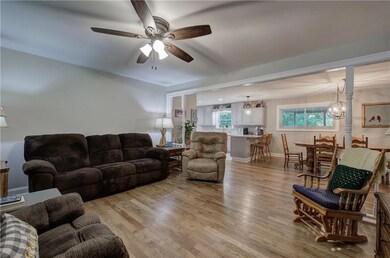 Living room with light hardwood flooring and ceili