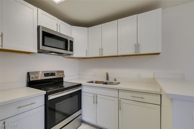 Kitchen featuring appliances with stainless steel