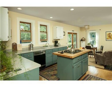 Kitchen. The kitchen is open to a...