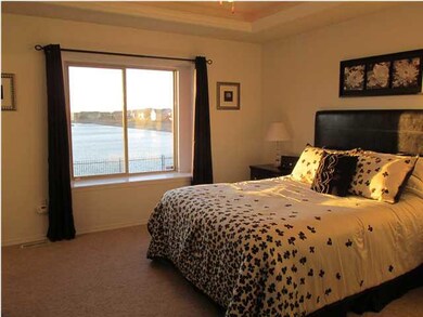 Relax in the master bedroom with a great view of t