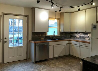 kitchen has newer cabinet fronts and appliances- c