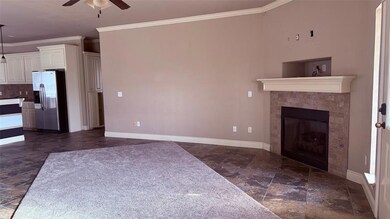 Unfurnished living room with stone finish floor, b