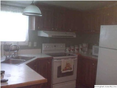 Neat and tidy kitchen with eat in area.