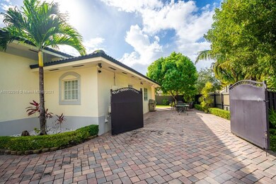 Front  of house view of side of house with gates o