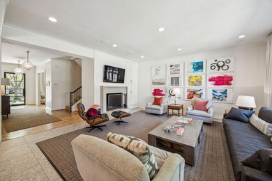 Living room with recessed lighting, crown molding,