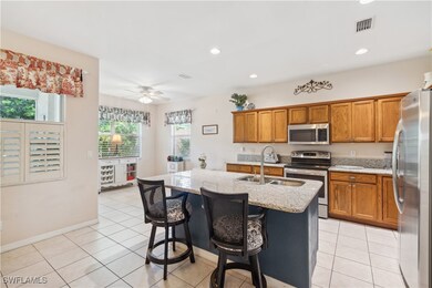 Kitchen featuring light stone countertops, a kitch