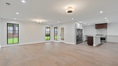 Unfurnished living room featuring light wood-type 