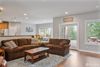 Living Room continued - and with a splash of light and stark lines.  French Doors lead out to the large back (Trex) deck