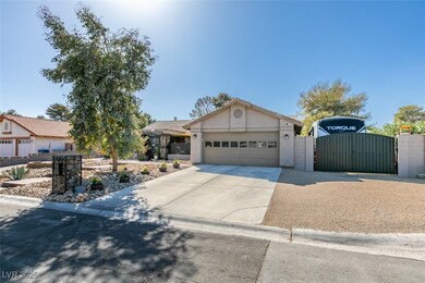 View of front of house featuring concrete driveway