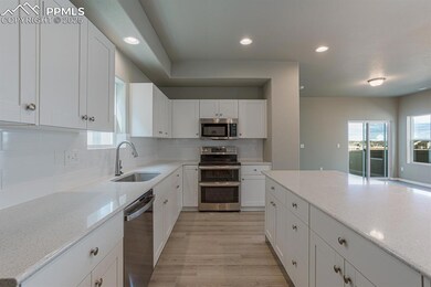 Kitchen featuring light wood-style flooring, white