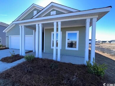 View of front of property featuring a garage and a