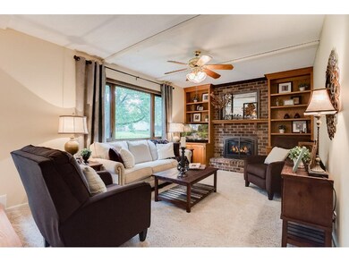 Warm great room atmosphere is created by the gas f