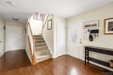 Entrance foyer featuring dark hardwood / wood-style flooring