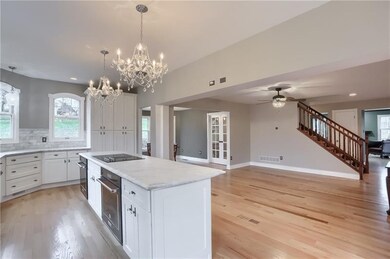 Dual ovens are featured in the oversized kitchen i