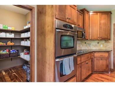 Great walk-in pantry with custom shelving adds uti