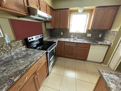 Spacious kitchen with plenty of cabinet space.