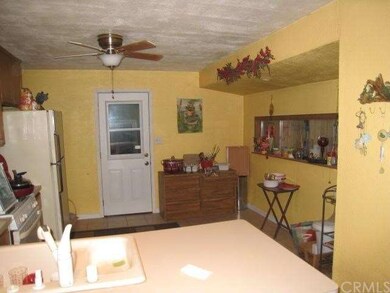Updated kitchen with tile flooring and warm colors
