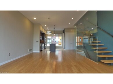 Contemporary accents of glass and hardwood floor h