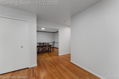 Foyer with hardwood floors and double closets