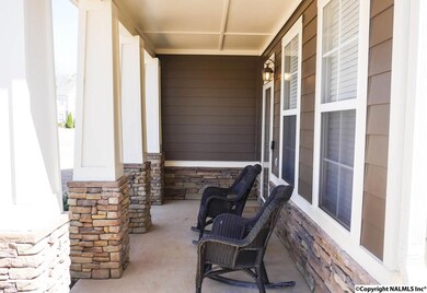 The covered front porch is ample for a seating area.  Enjoy cool, breezy afternoons on the porch!