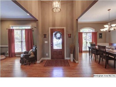 Solid oak hardwood flooring abounds in this custom
