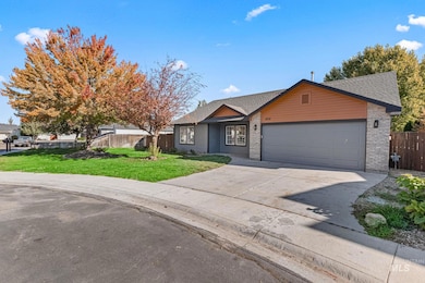 Ranch-style home featuring driveway, brick siding, an attached garage, and roof with shingles