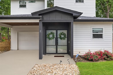 View of exterior entry featuring an attached gara