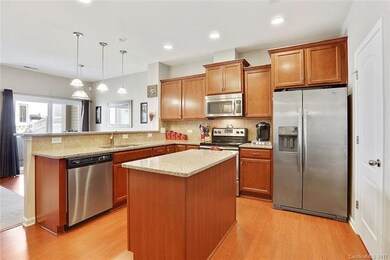 Kitchen with Granite Counter Tops & SS Appliances