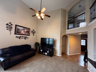 Living room has 18 foot ceilings for an airy feel