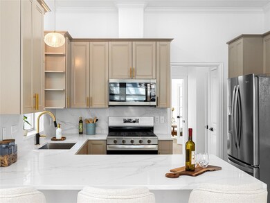 Kitchen with light stone countertops, ornamental 