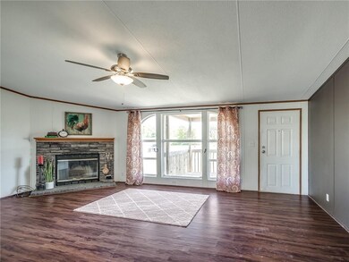 spacious living room with wood burning fireplace, 