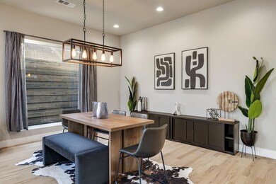 Dining area featuring an inviting chandelier and l
