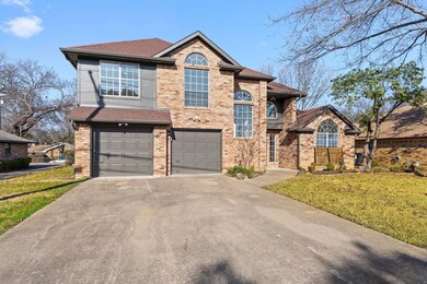 View of front of property featuring a garage and a