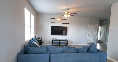 Living area with wood finished floors and ceiling