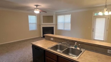 Kitchen featuring black dishwasher, a sink, orname