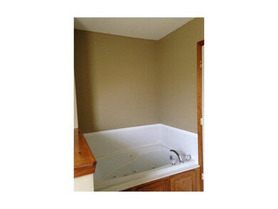Whirlpool tub in master. Toilet is separated by a 
