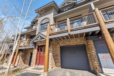 View of property featuring asphalt driveway