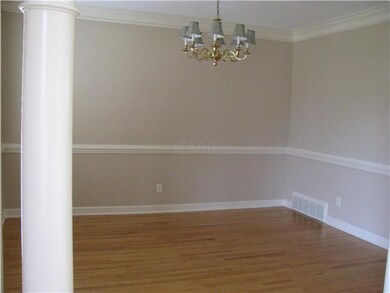 Formal Dining room with butler's pantry and hardwo