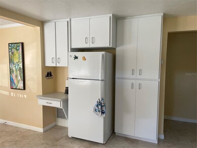 Another view of the tall pantry cabinet, refrigera