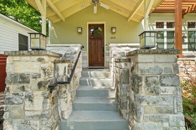 Doorway to property featuring stone siding and st