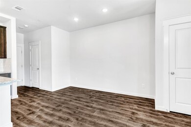 Empty room with dark wood-type flooring