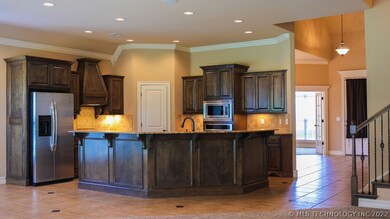 Granite kitchen with SS appliances and walk in pan