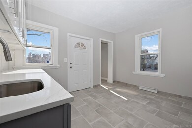 Large and brand new eat in kitchen, with quartz co