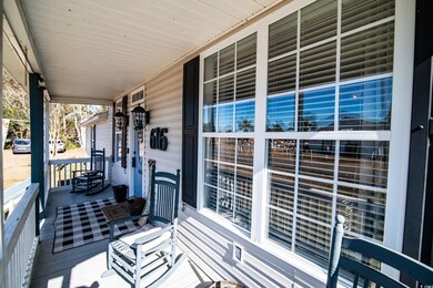 Wooden deck featuring covered porch